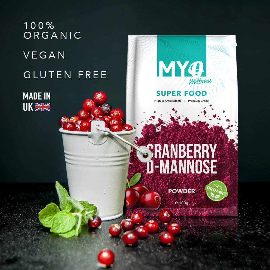 MYOwellness Cranberry D-Mannose Super Food packaging with cranberries and mint leaves on a dark background