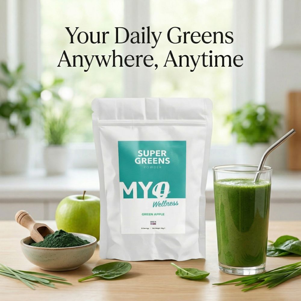 Organic greens superfood powder package with a glass of green juice on a table, surrounded by plants.