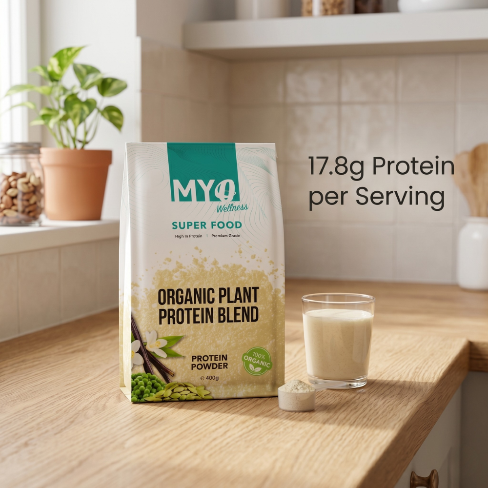 MYOwellness vanilla plant protein powder package on a kitchen counter with a glass of protein shake.